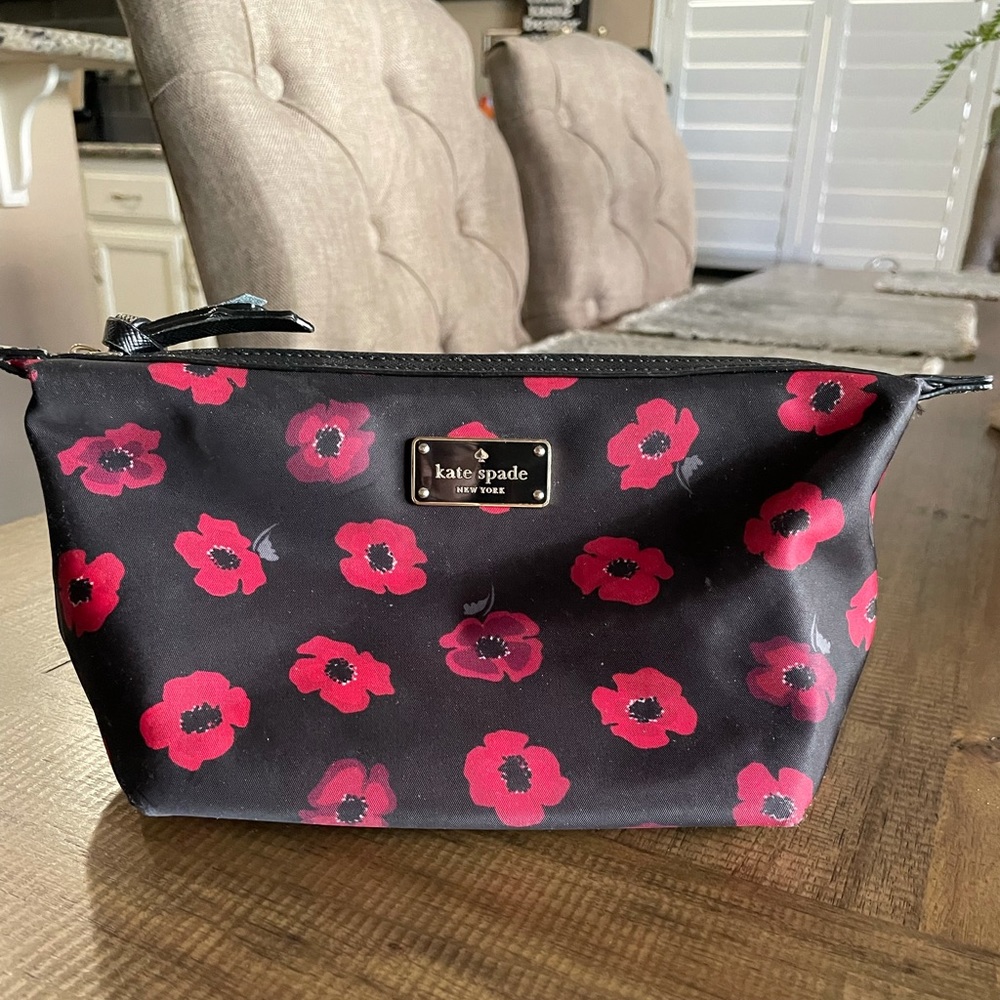 Gently used Kate Spade Medium Sized makeup bag.